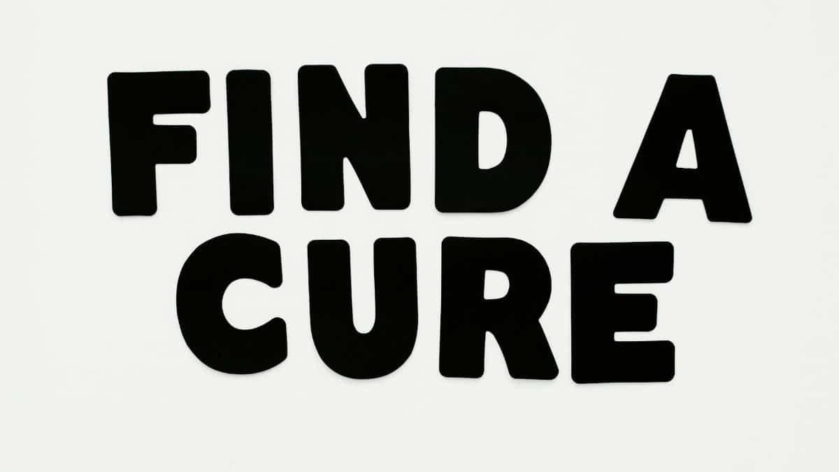 Bold black text 'Find a Cure' on a white background, promoting awareness.