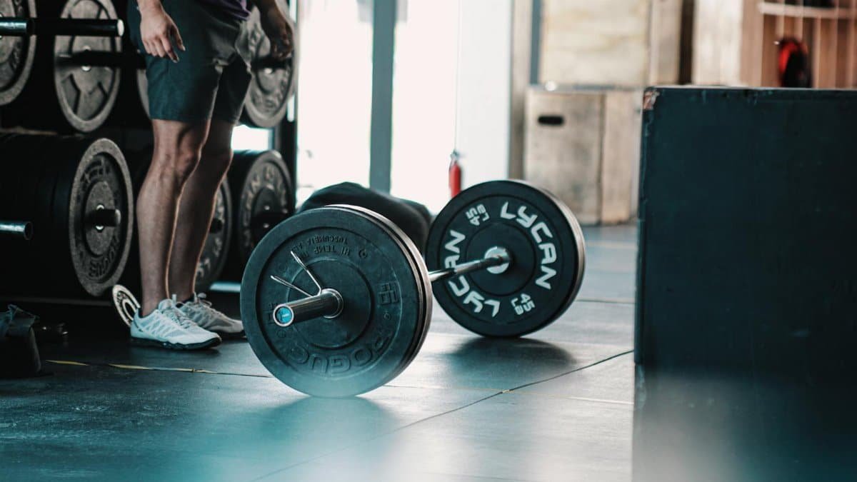 Close-up of a barbell in a gym, ready for a strength-training session.