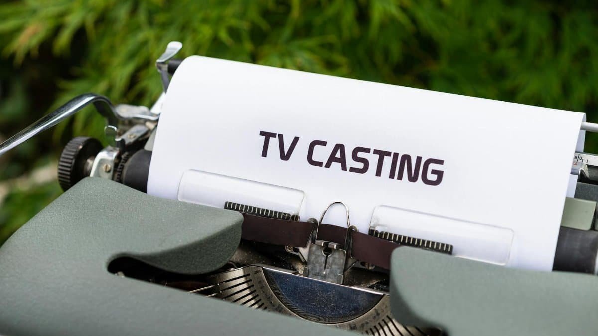 Close-up of a vintage typewriter with a sheet saying 'TV Casting', emphasizing the concept of scriptwriting.