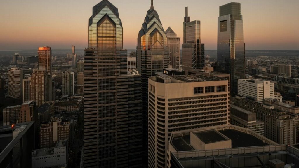 Breathtaking view of Philadelphia's modern skyline at sunset featuring iconic skyscrapers.