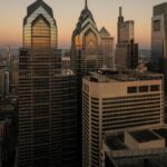 Breathtaking view of Philadelphia's modern skyline at sunset featuring iconic skyscrapers.