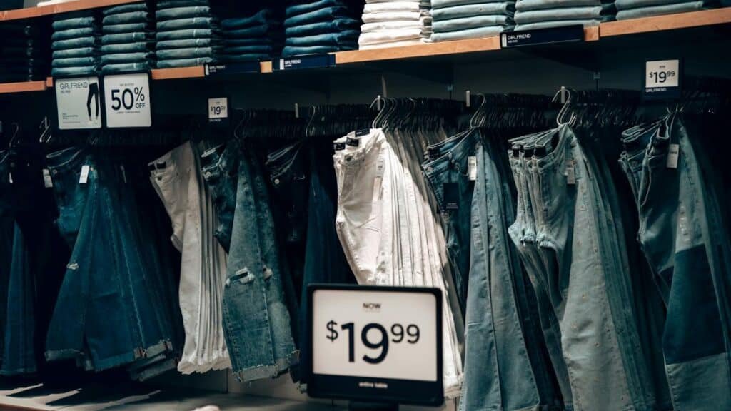 Explore a stylish denim collection at a boutique in Miami, showcasing jeans with discounts.