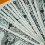 Closeup of novelty one million dollar bills laid out in a fan arrangement.