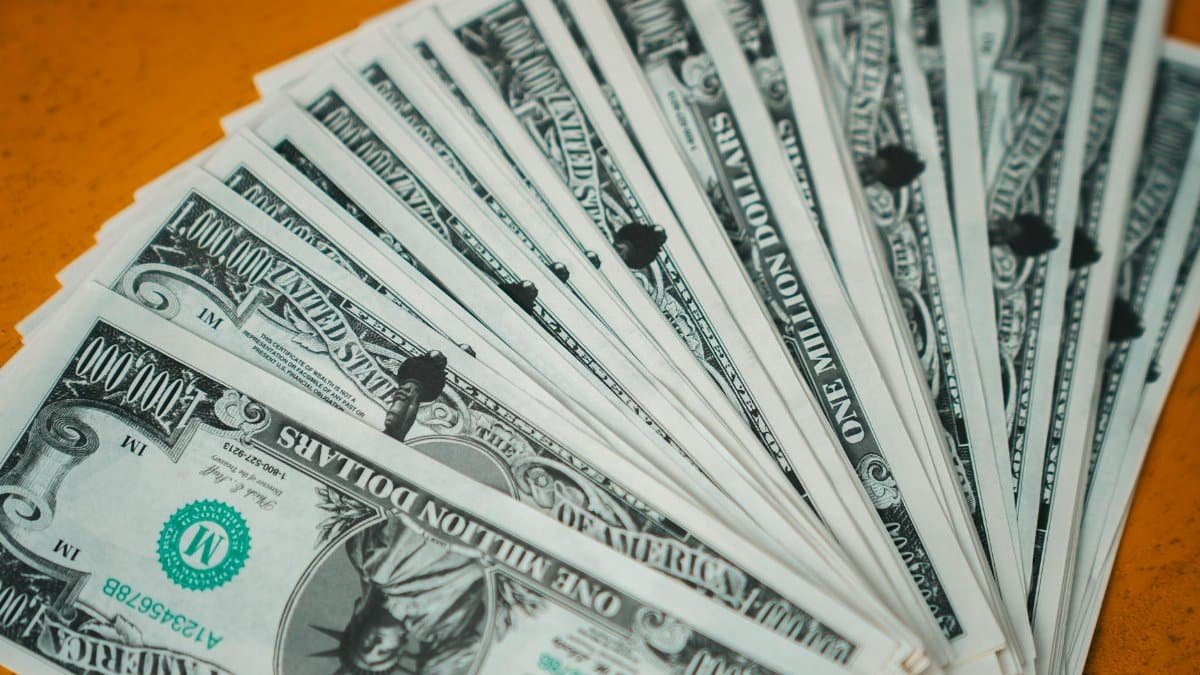 Closeup of novelty one million dollar bills laid out in a fan arrangement.