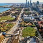 Stunning aerial shot of Chicago featuring Millennium Park, Lake Michigan, and downtown skyline.