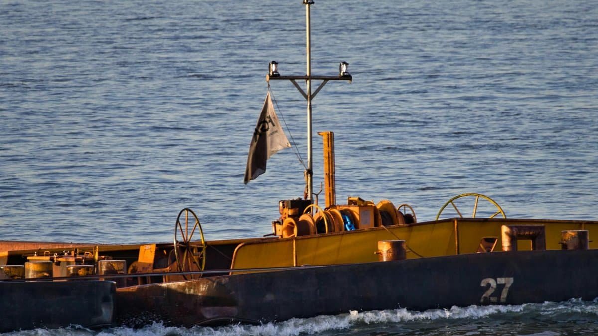 A pusher boat on an inland waterway, highlighting transportation and logistics.