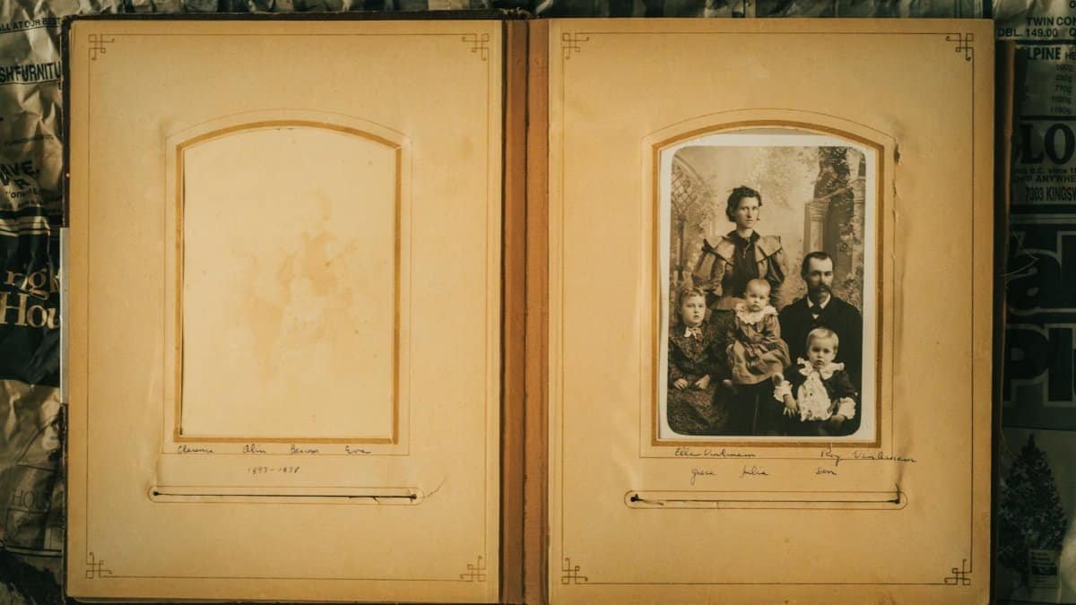 A nostalgic look at a vintage family photo album featuring sepia tones and historical family portraits.