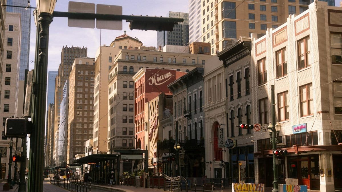 Charming street view of downtown Houston with historic buildings on a sunny day.