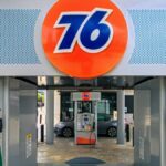 Front view of a 76 gas station in Houston, Texas on a sunny day.
