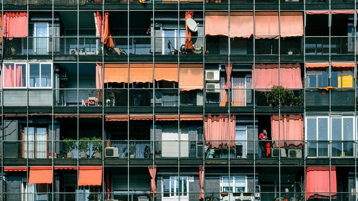 A colorful and dynamic facade of modern apartments in Barcelona, Spain.