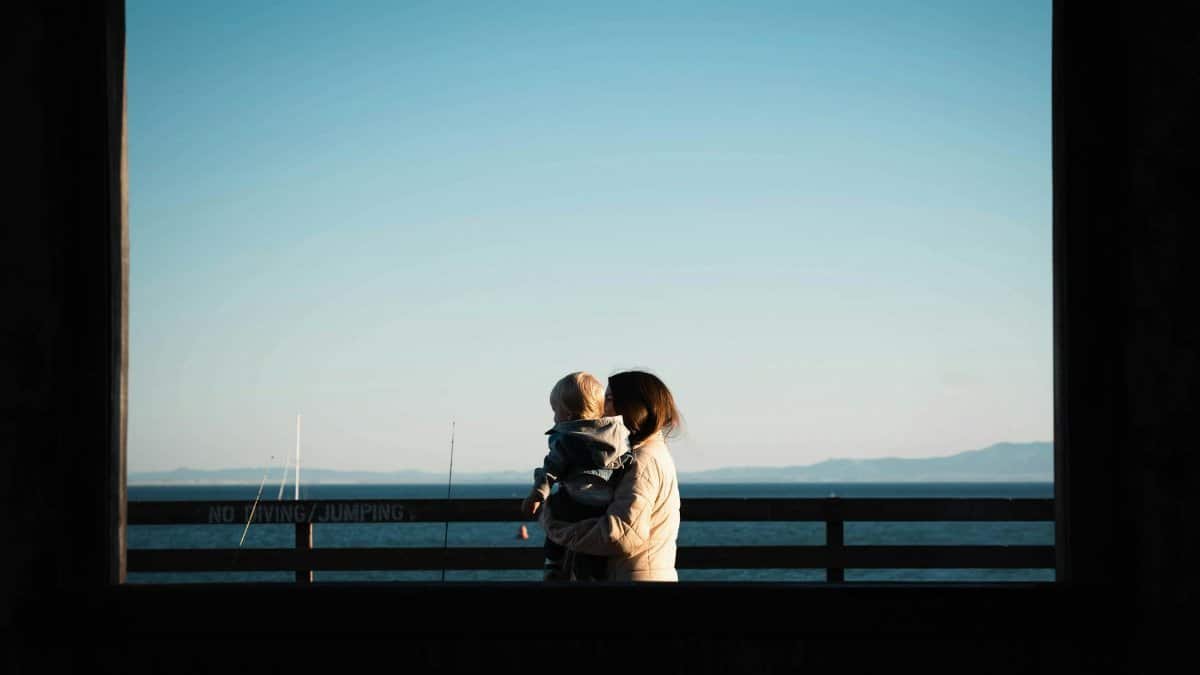 A tender moment between mother and child overlooking Avila Beach at sunset.