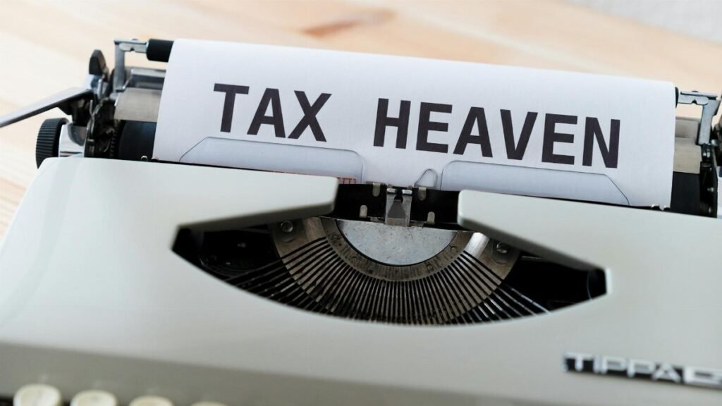 Close-up of a vintage typewriter displaying the words 'TAX HEAVEN', conveying a conceptual financial theme.