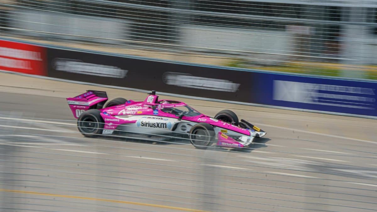Blazing speed captured at the Toronto Indy Car race, featuring a vivid open-wheel racing car.