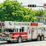 City of Miami fire-rescue truck with dive team module on a sunny street.