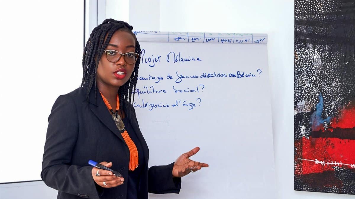 African American businesswoman analyzing data during an office presentation.