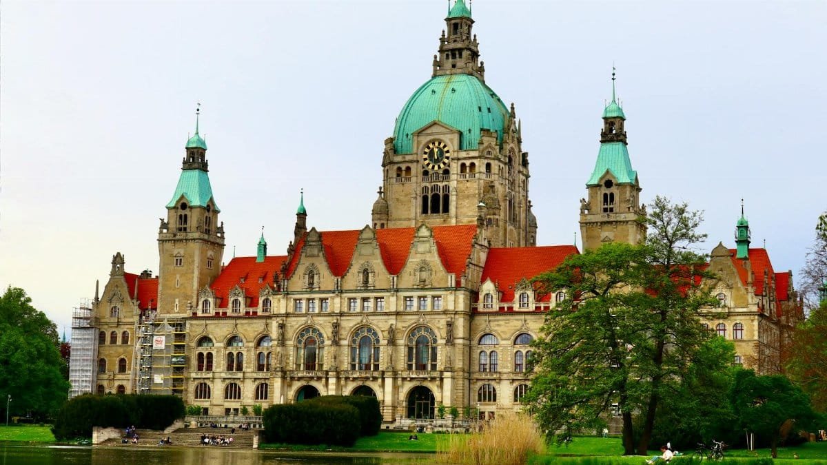 Stunning view of the New Town Hall in Hannover with a reflection in the pond.