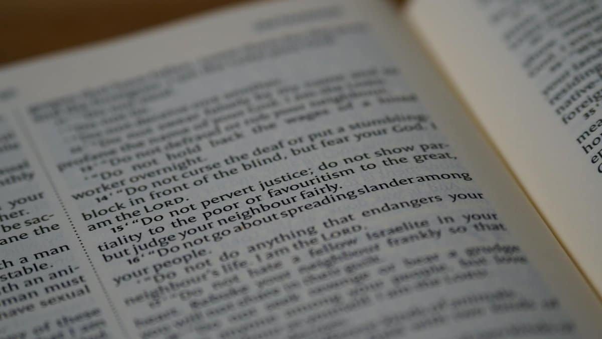 Close-up shot of a Bible page with selective focus on text.