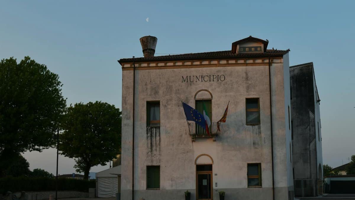 Capture of a weathered municipio building in Veneto, Italy during evening light.