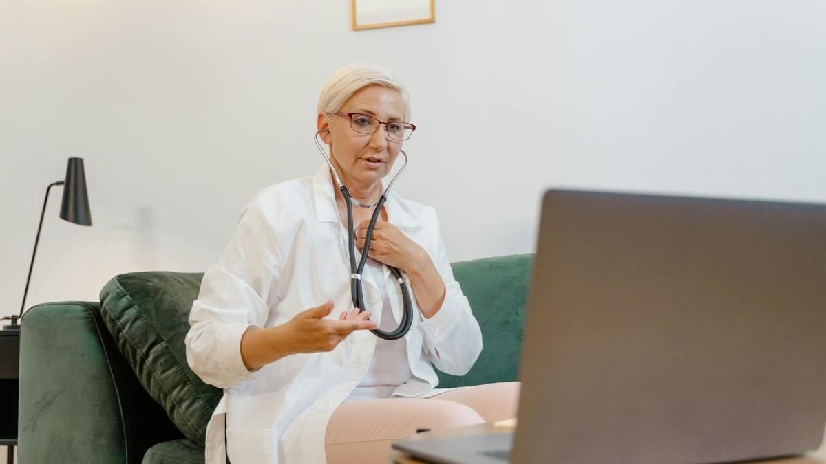 Professional female doctor using telemedicine technology for a virtual consultation. Ideal for healthcare themes.