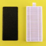 Black foam filter and white air filter on bright yellow backdrop showcasing air purification essentials.