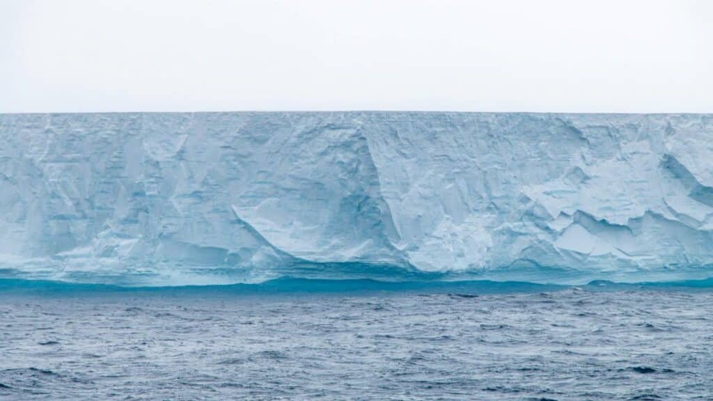 Stunning iceberg in Antarctica showcasing pristine ice formations above the ocean.