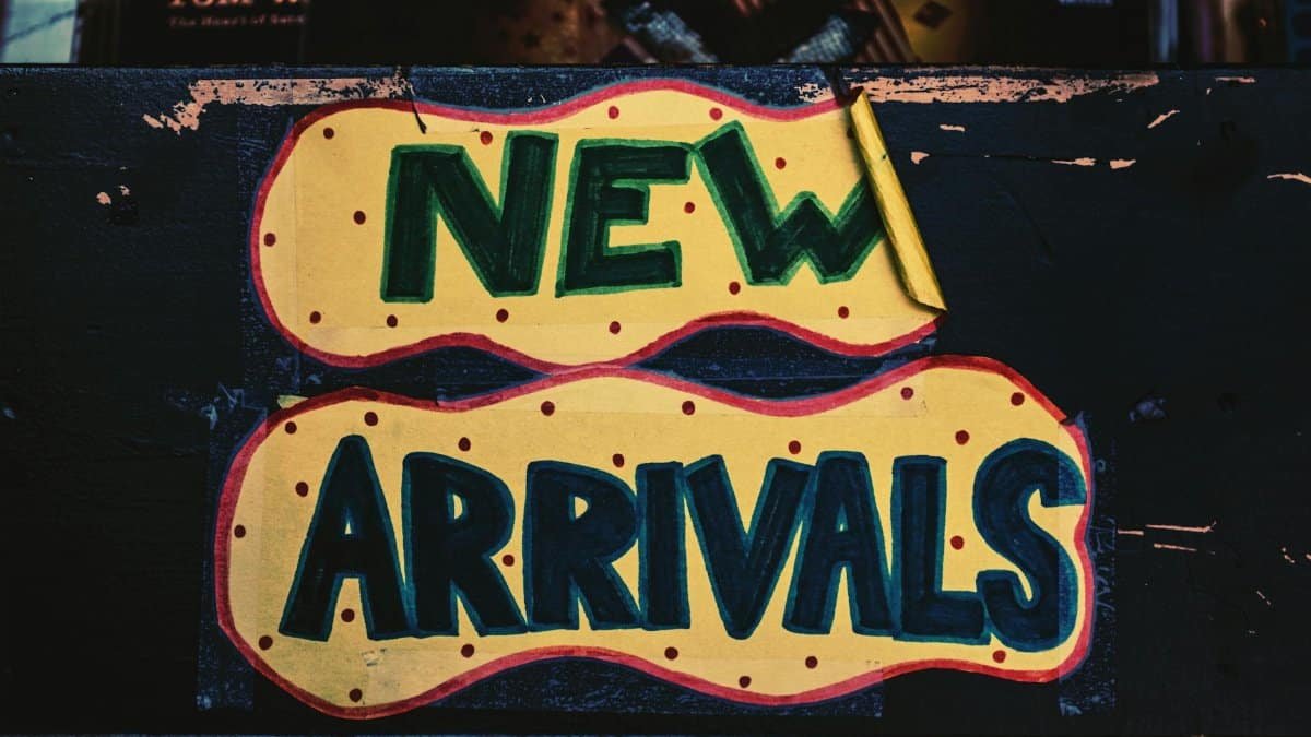 A vibrant handmade 'New Arrivals' sign with bold colors, displayed in a Los Angeles store.