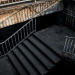 Brutalist urban stairs in Yerevan with dramatic lighting and gritty atmosphere.