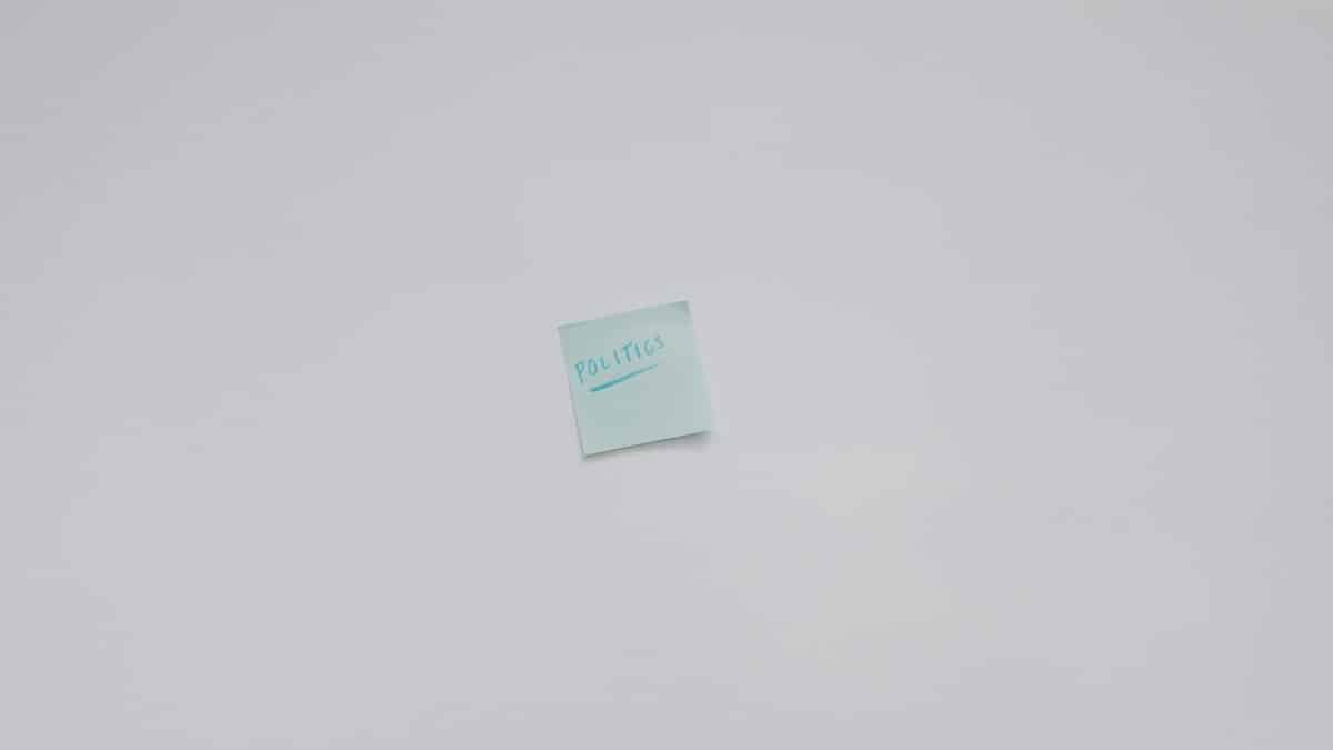 Simple top view of a note with the word 'Politics' on a white background.