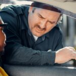 A police officer interacts with a driver through a car window, emphasizing law enforcement and public safety.