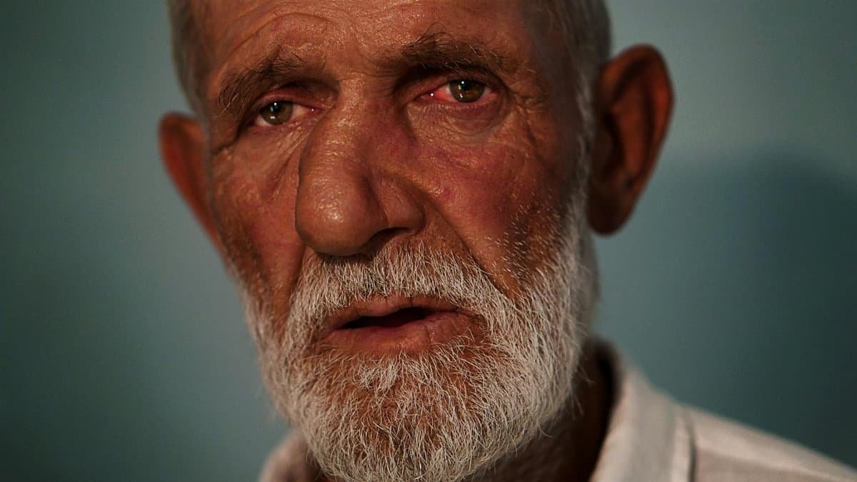 Close-up portrait of an elderly man with a beard and mustache in Dagestan, Russia.