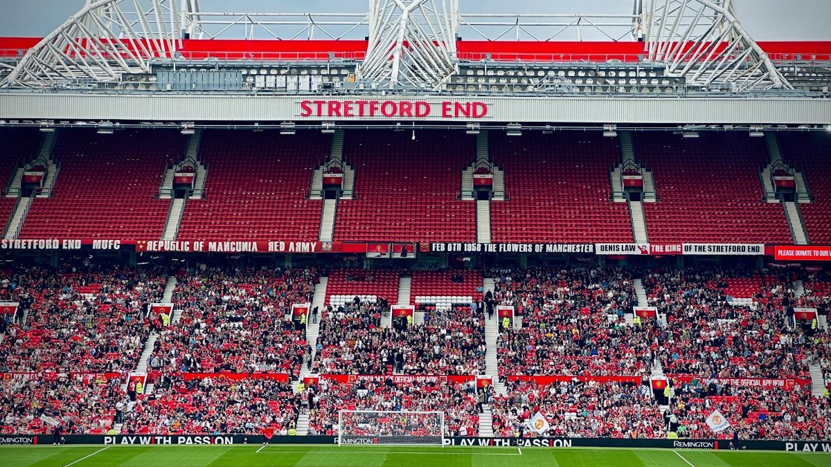 View of the Stretford End crowd at Manchester's iconic stadium during a day event.