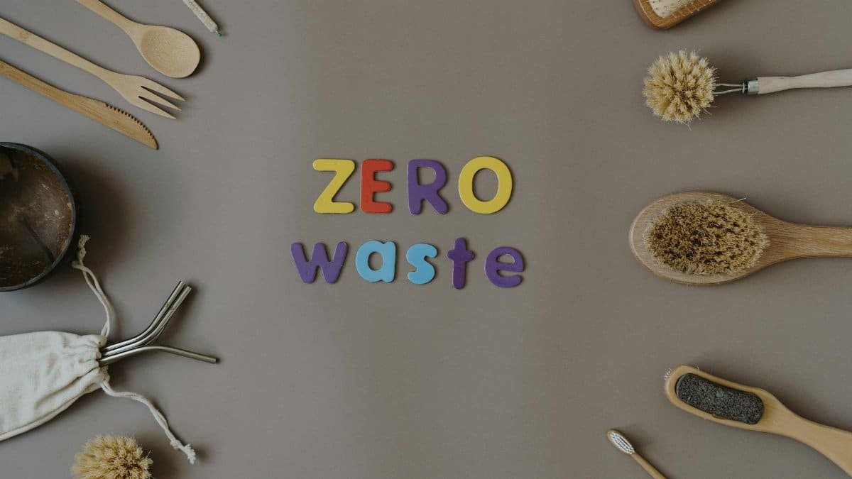 A stylish flat lay of zero waste kitchen and personal care items emphasizing sustainability.