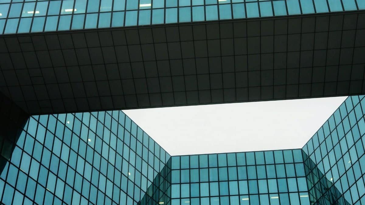 Modern architectural design with geometric glass windows creating a futuristic urban facade.