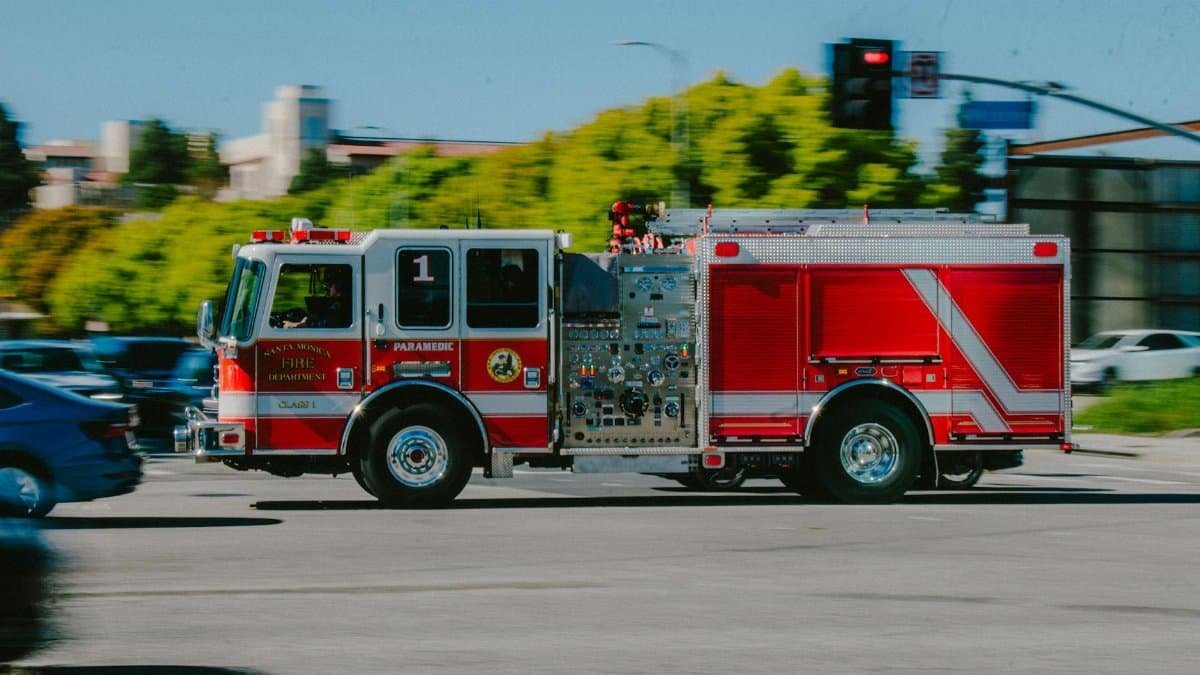 Fire truck from Santa Monica Fire Department in motion on a city street.