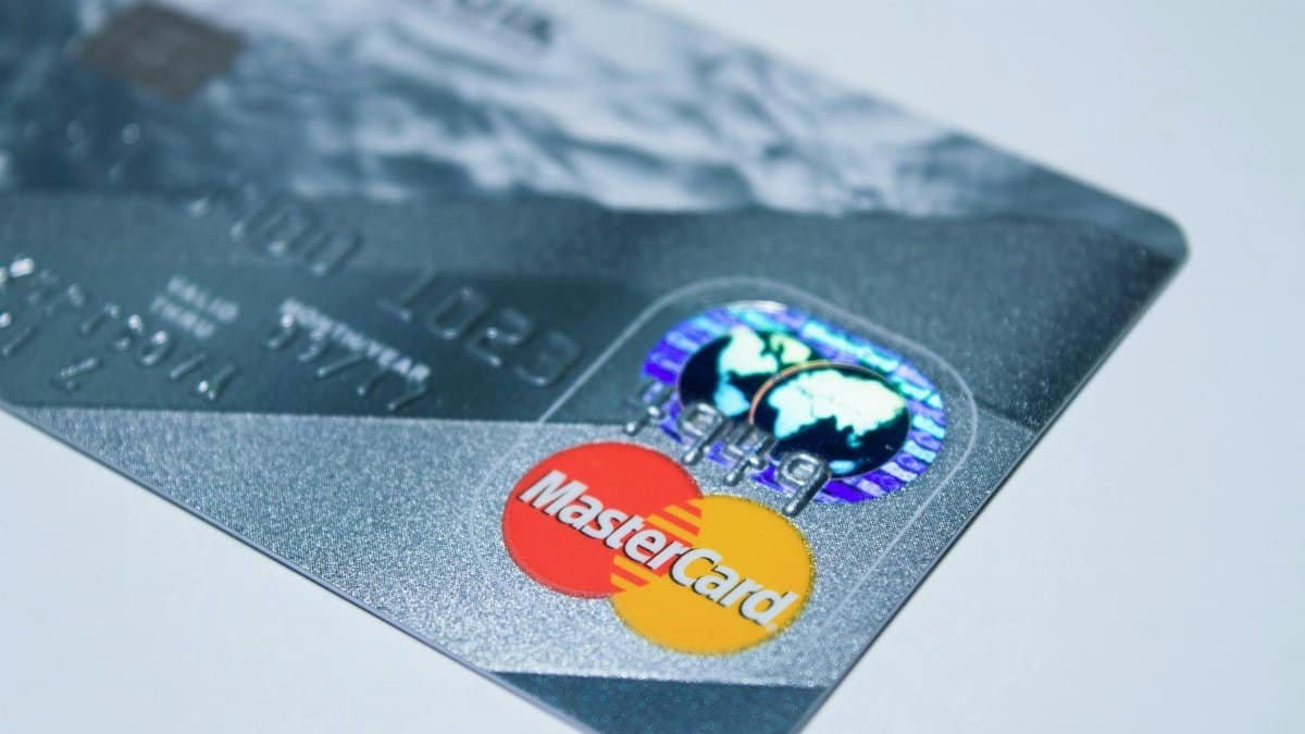 Detail shot of a MasterCard credit card, showing the chip and logo.