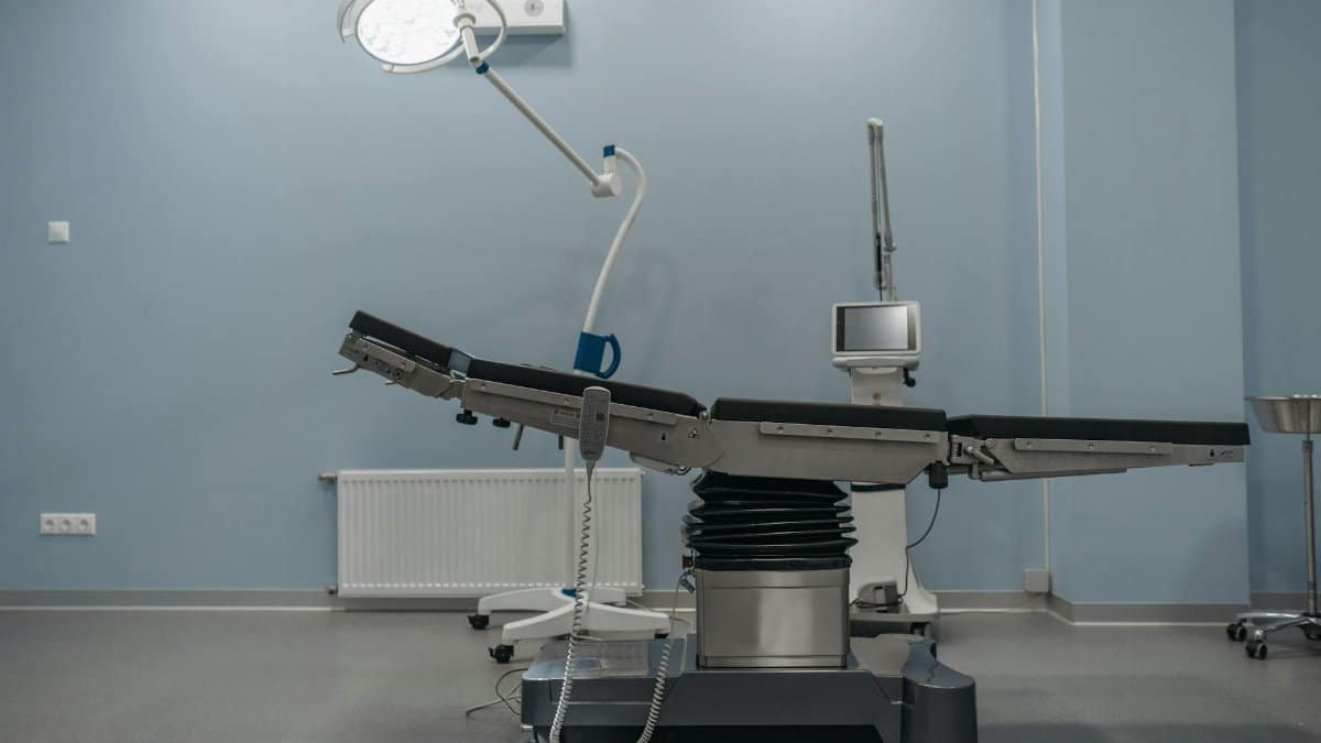 A contemporary operating room showcasing state-of-the-art medical equipment and surgical table.