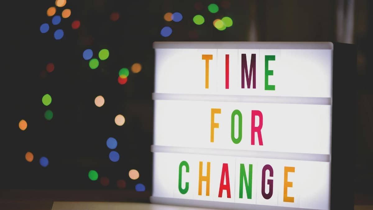 Colorful illuminated sign displaying the motivational message 'Time for Change'.