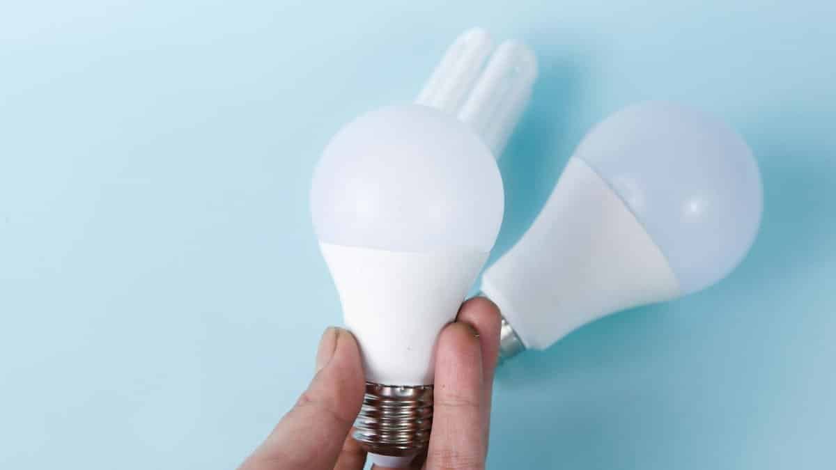 Two LED light bulbs on a blue background, highlighting energy efficiency.
