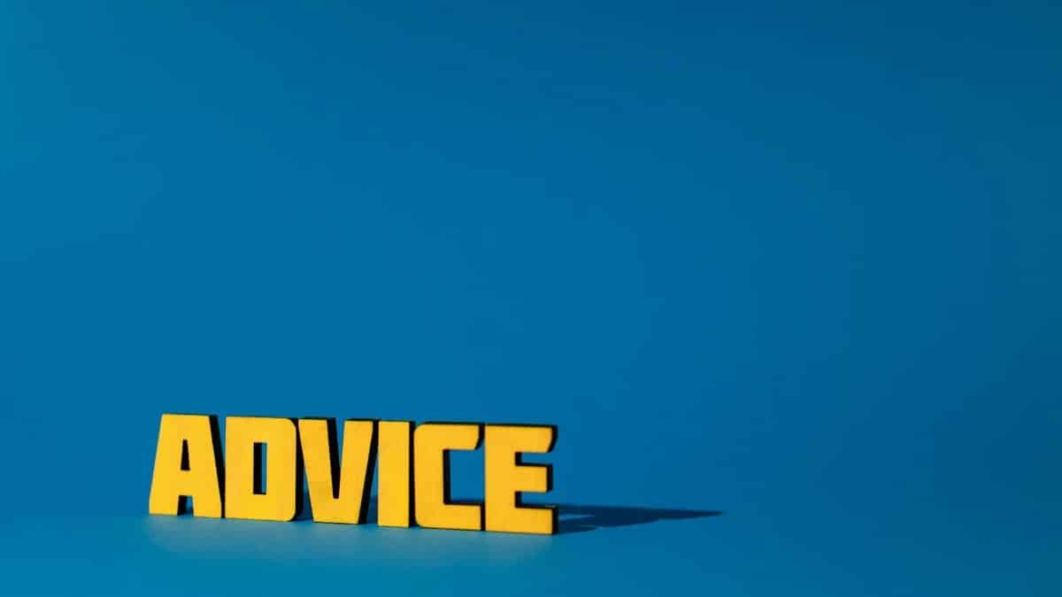 Yellow letters spelling 'Advice' on a vibrant blue background with ample copy space.