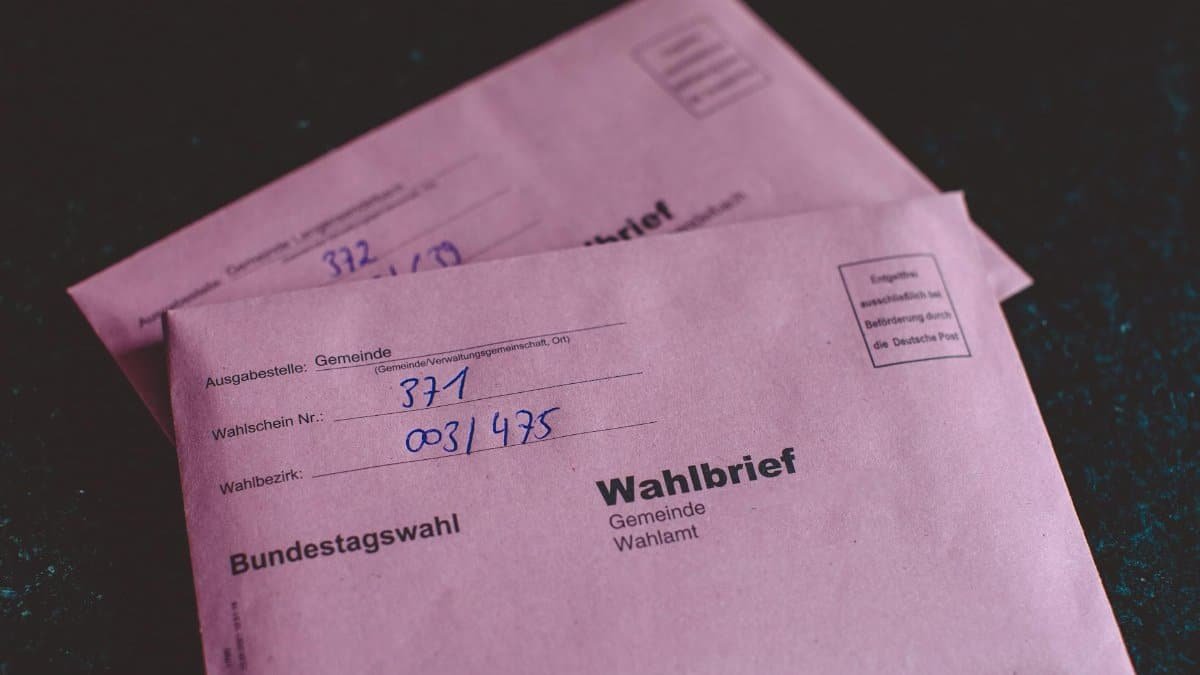 Close-up of German election ballot envelopes for the Bundestag election, showcasing voting documents.