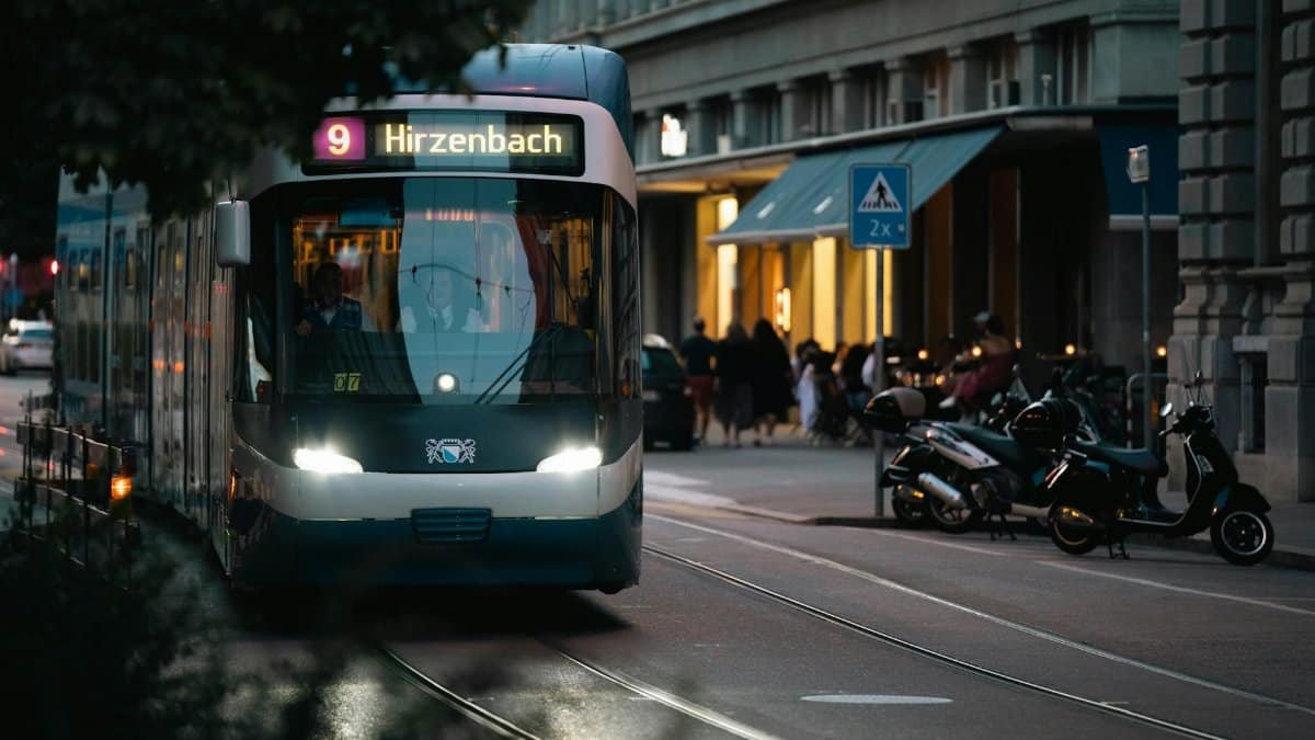 City tram at twilight on an urban street, capturing evening hustle and transport dynamics.