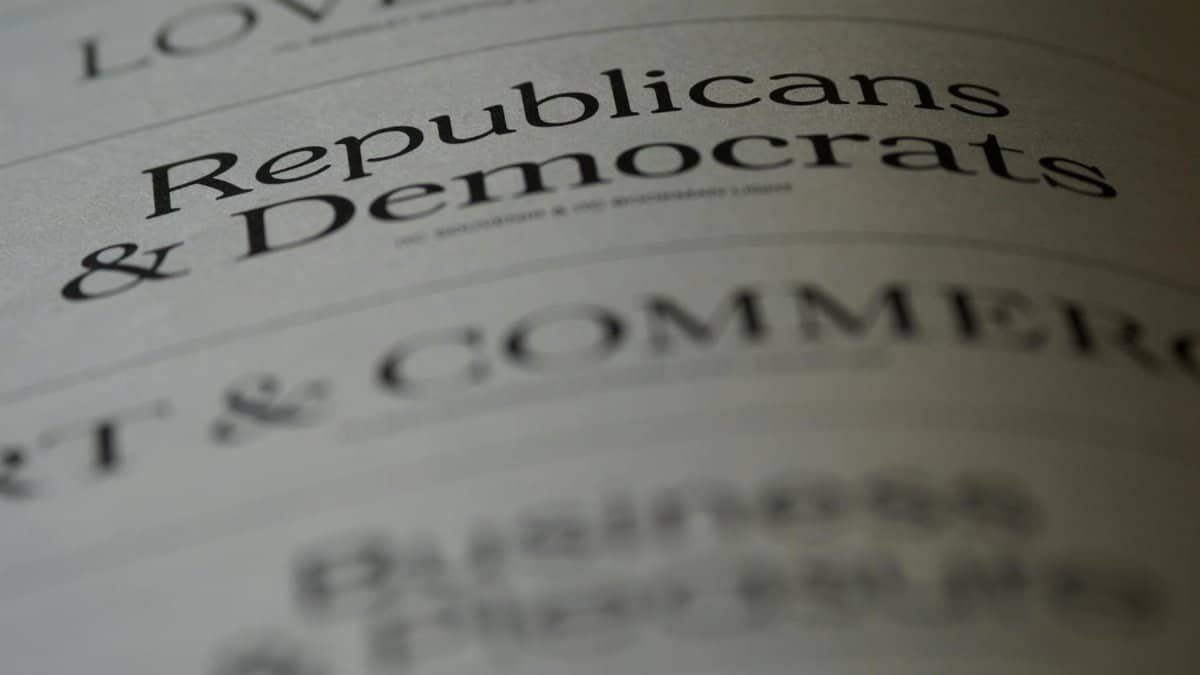 Close-up of blurred text page with 'Republicans & Democrats', focusing on political themes.