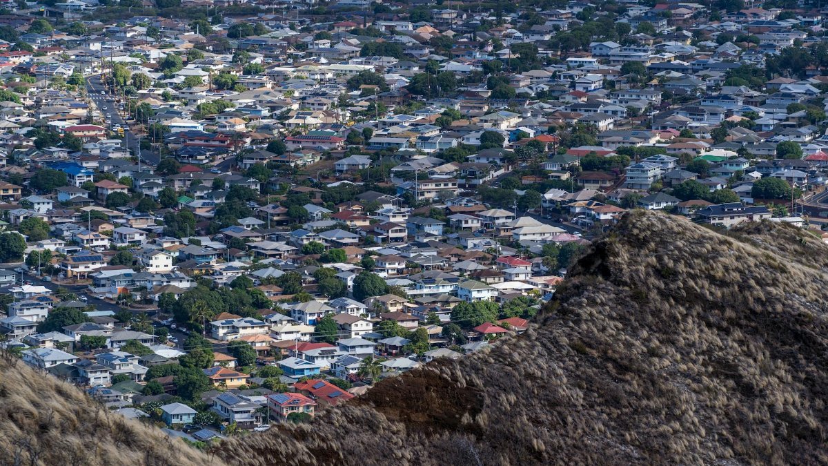 A stunning aerial view of a residential district in Honolulu, showcasing urban density and architecture.