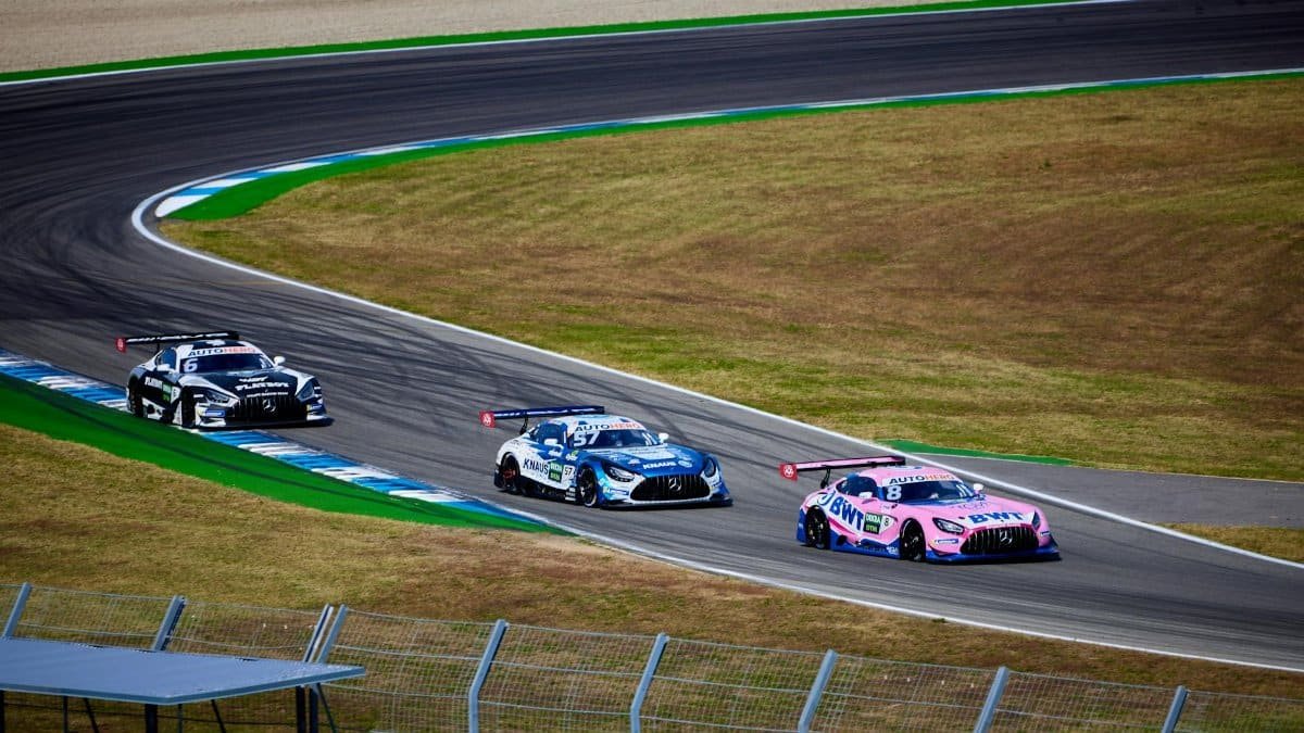 Exciting sports car race on Hockenheim Circuit, showcasing speed and skill on the track.