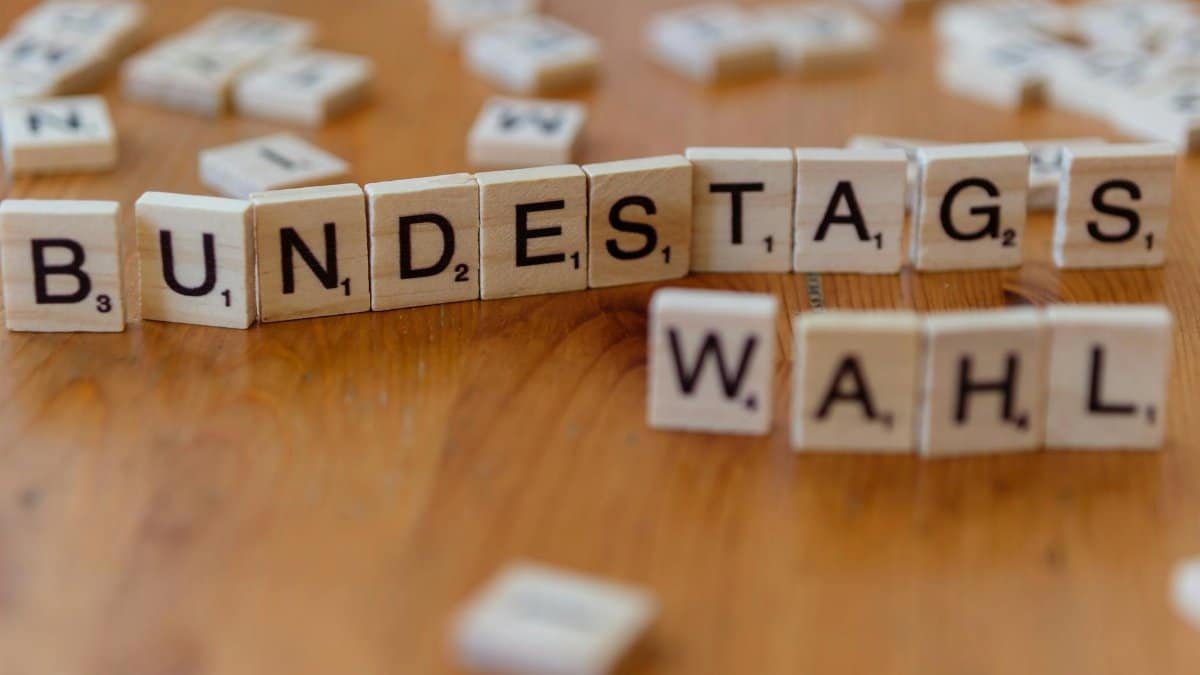 Scrabble tiles spelling 'Bundestagswahl', symbolizing German election themes.