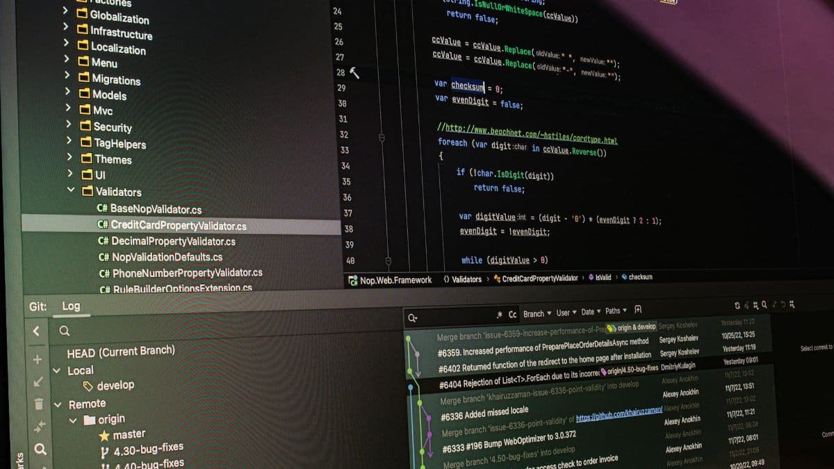 Close-up of software development tools displaying code and version control systems on a computer monitor.
