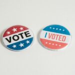 Red, white, and blue political buttons with 'Vote' and 'I Voted' text for election and civic engagement themes.