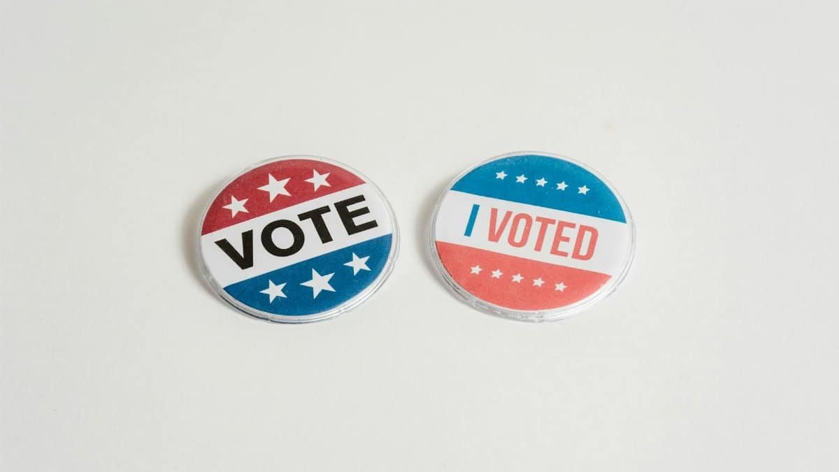 Red, white, and blue political buttons with 'Vote' and 'I Voted' text for election and civic engagement themes.