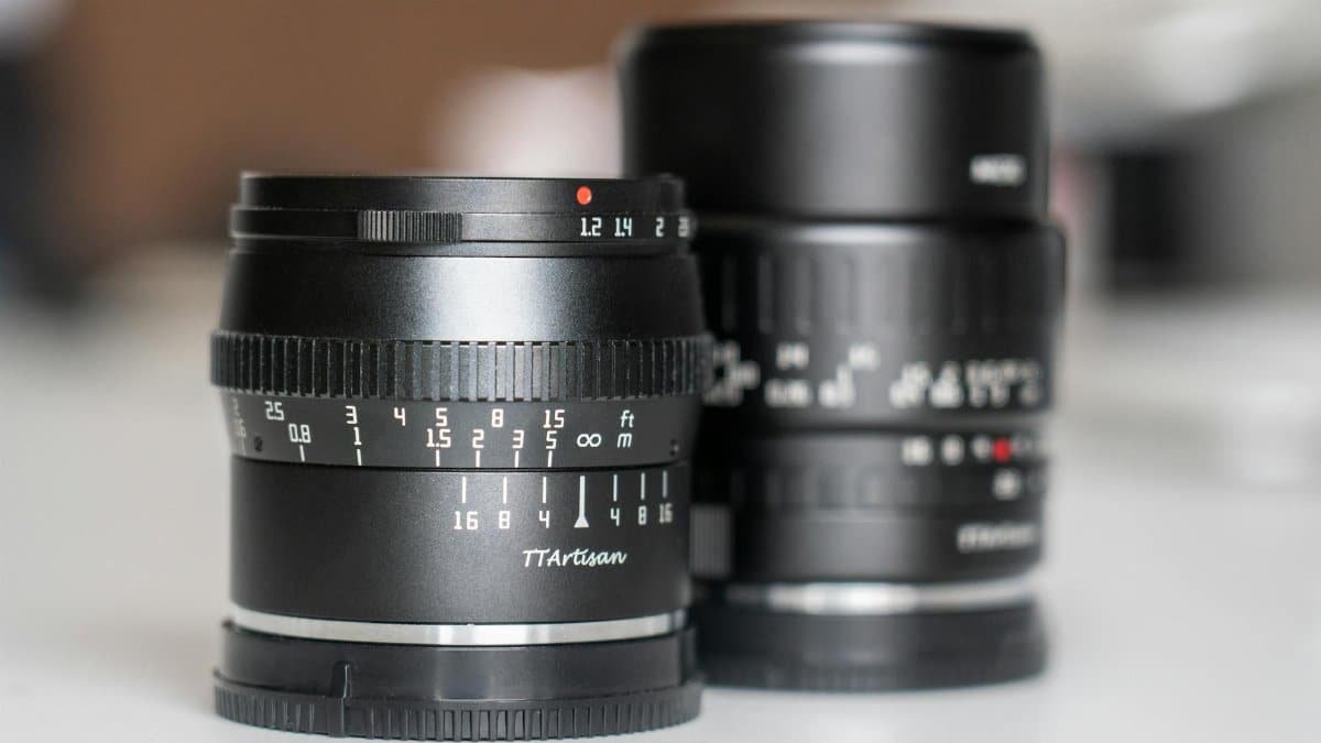 Two camera lenses showcased with detailed focus on aperture and focal length settings.