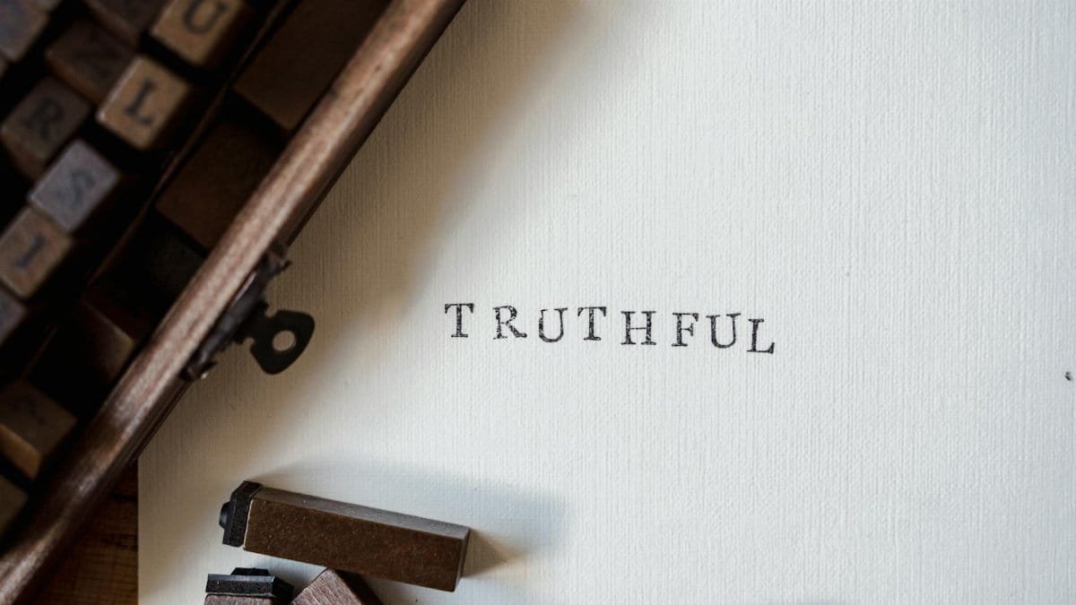 Close-up of vintage letterpress with the word 'TRUTHFUL' on paper.